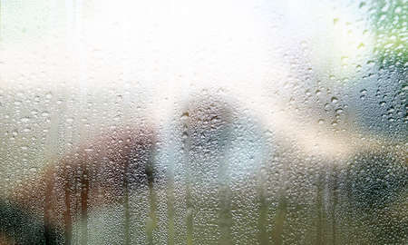 Condensation on the glass. Rain drops on the window. Abstract background.