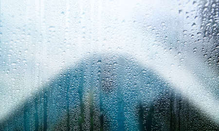 Rain drops on window glass, closeup view. Raindrops on window glass.