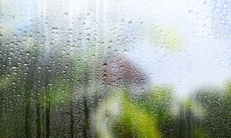 Background with rain drops close up. Rain drops on outdoor window, Closeup view transparent water...