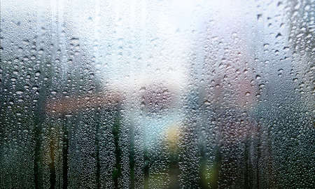 Rain drops on window glass. Raindrops on window glass background.