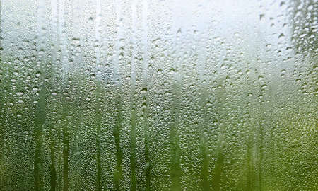 Water drops on window glass. Rain drops on window glass background.