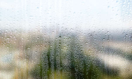Background with rain drops on the glass, blurred background with copy space for your text