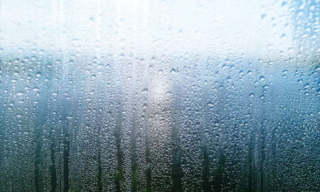 Condensation on the window. Water drops on the glass. Rainy weather.