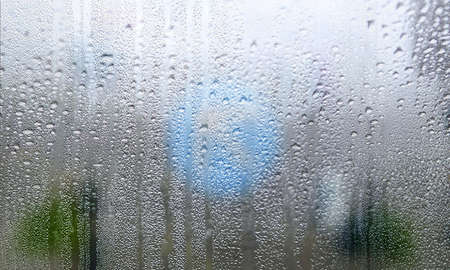 Condensation on the window. Raindrops on the window. Water drops on the glass.