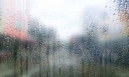 Background with rain drops close up. Rain drops on outdoor window, Closeup view transparent water...