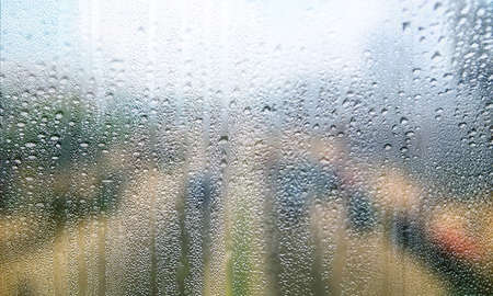 Background with rain drops close up. Rain drops on outdoor window, Closeup view transparent water...