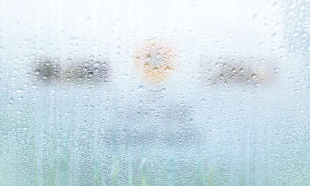 Drops of rain on the window, abstract background with copy space