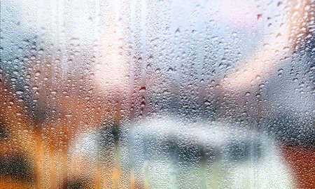 Background with rain drops close up. Rain drops on outdoor window, Closeup view transparent water...