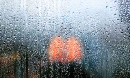 Background with rain drops close up. Rain drops on outdoor window, Closeup view transparent water...
