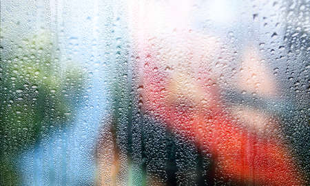 Background with rain drops close up. Rain drops on outdoor window, Closeup view transparent water...