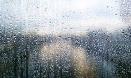 Condensation on the window. Rain drops on the window. Natural background