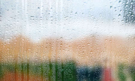 Background with rain drops close up. Rain drops on outdoor window, Closeup view transparent water...