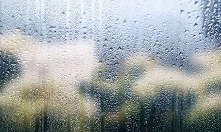 Condensation on window glass close up. Rain drops on window glass close up.