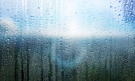 Water drops on window glass, closeup view. Rainy weatherの写真素材