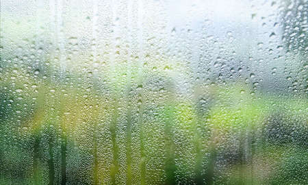 Background with rain drops close up. Rain drops on outdoor window, Closeup view transparent water...