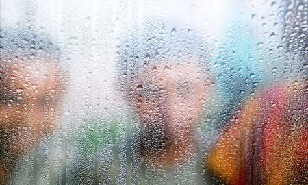 Background with rain drops close up. Rain drops on outdoor window, blurred background with copy...