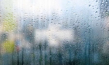 Background with rain drops close up. Rain drops on outdoor window, Closeup view transparent water...