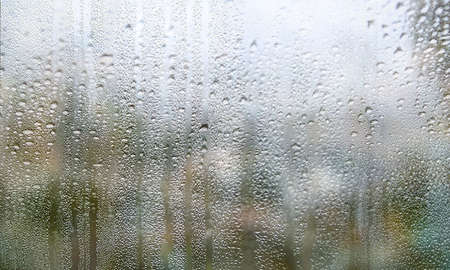 Condensation on the window. Rain drops on the glass. Raindrops on the window.