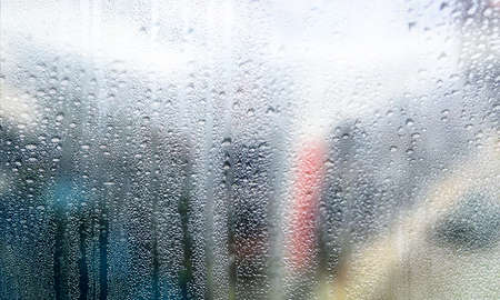 Condensation on the window. Rain drops on the glass. Abstract background