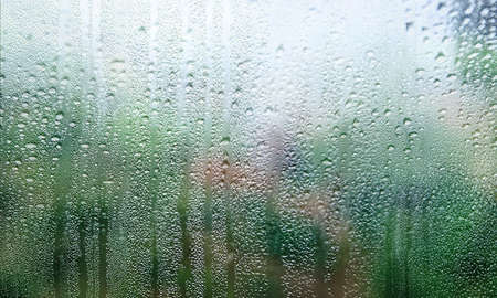 Background with rain drops close up. Rain drops on outdoor window, Closeup view transparent water...