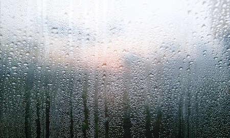Condensation on the window. Raindrops on the window. Natural background.の写真素材