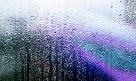 Condensation on the window. Water drops on the glass. Abstract background.
