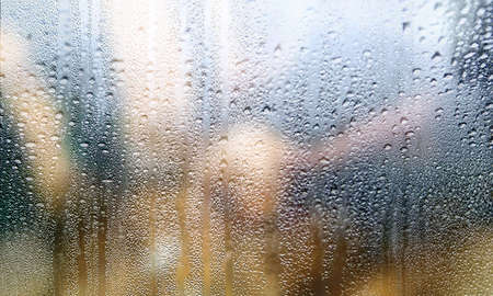 Background with rain drops close up. Rain drops on outdoor window, Closeup view transparent water...