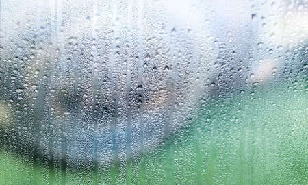 Background with rain drops close up. Rain drops on outdoor window, Closeup view transparent water...