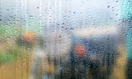 Water drops on the glass, blurred background. Condensation on the window.