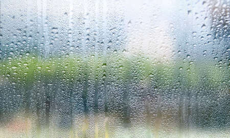 Background with rain drops close up. Rain drops on outdoor window, Closeup view transparent water...