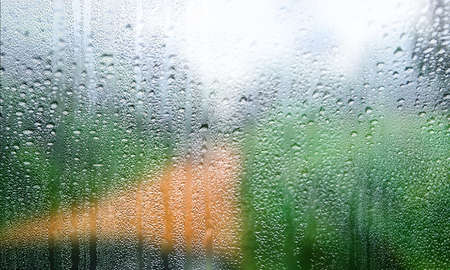 Background with rain drops close up. Rain drops on outdoor window, Closeup view transparent water...