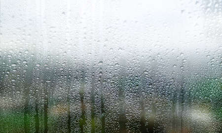 Rain drops on the window. Raindrops on the window glass.