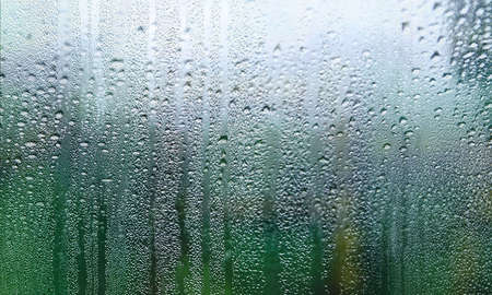 Background with rain drops close up. Rain drops on outdoor window, Closeup view transparent water...