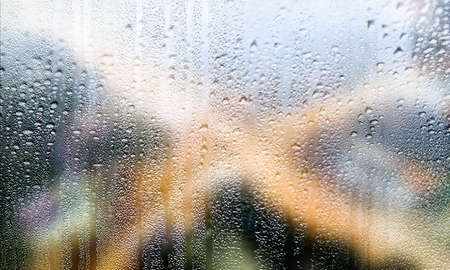 Water drops on the window. Rain drops on the window. Abstract background.