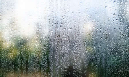 Background with rain drops close up. Rain drops on outdoor window, Closeup view transparent water...