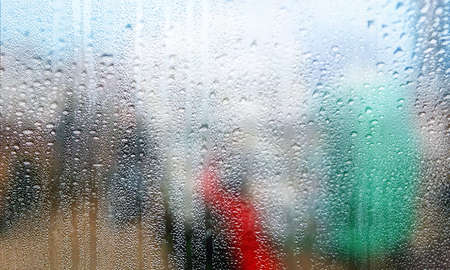 Background with rain drops close up. Rain drops on outdoor window, Closeup view transparent water...