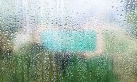Background with rain drops close up. Rain drops on outdoor window, Closeup view transparent water...