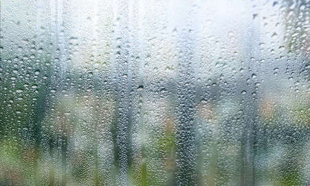 Background with rain drops close up. Rain drops on outdoor window, Closeup view transparent water...