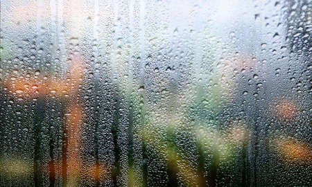 Condensation on the window, close-up. Raindrops on the glass, background