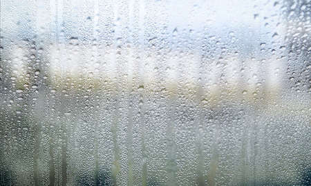 Condensation on the window. The concept of humidity and moisture.