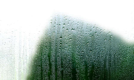 Condensation on the glass. Rain drops on the window. Abstract background.