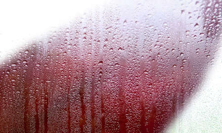 Condensation on the window, close-up. Raindrops on the glass.