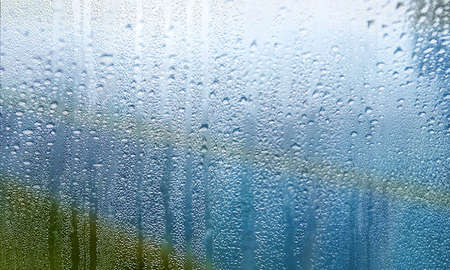 Condensation on the window. Raindrops on the window. Close-up.の写真素材