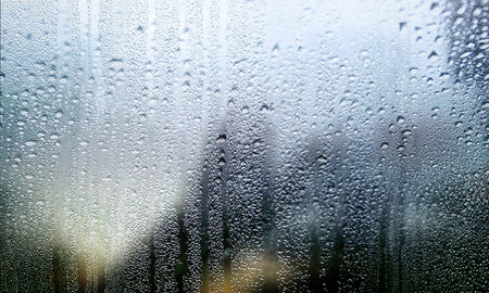 Water drops on the glass, condensation on the window, blurred background