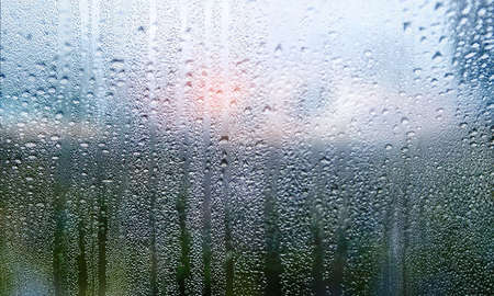 Condensation on the window. Rain drops on the glass. Natural background.