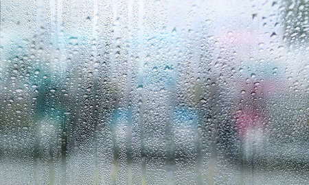 Background with rain drops close up. Rain drops on outdoor window, Closeup view transparent water...