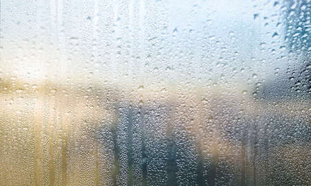 Condensation on the window. Rain drops on the glass. Rainy weather.