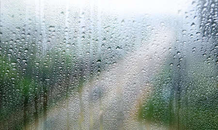 Background with rain drops close up. Rain drops on outdoor window, Closeup view transparent water...
