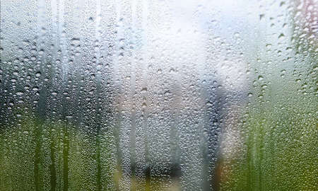 Background with rain drops close up. Rain drops on outdoor window, Closeup view transparent water...