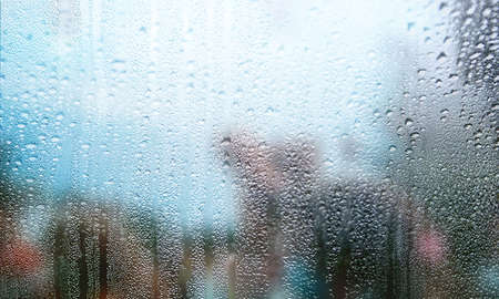 Background with rain drops close up. Rain drops on outdoor window, Closeup view transparent water...